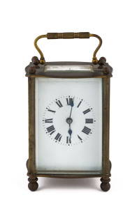 A French carriage clock with Roman numerals in brass case, early 20th century, stamped "Made In France", ​14cm high