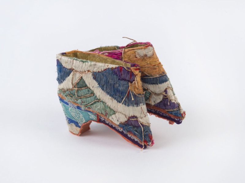 A pair of Chinese feet binding shoes, embroidered silk, 20th century, ​8.5cm high, 11cm long