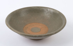 A Thai celadon pottery bowl, 16th century, 5cm high, 16cm diameter