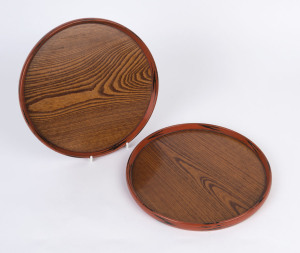 A pair of Japanese circular lacquered serving trays, Showa period, 20th century, 27cm diameter