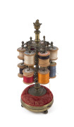 A French antique cotton reel holder, bronze with pin cushion base, early 19th century, 26cm high