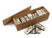 DOMINOES, whalebone and ebony in wooden case, 19th century, ​the case 18cm wide