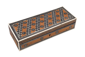 An Anglo-Indian Sideli glove box, silver, bone, ebony and sandalwood, 19th century, 5.5cm high, 26cm wide, 10cm deep