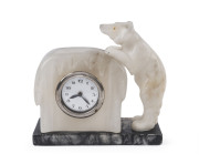 A German Art Deco polar bear clock, marble and alabaster, circa 1930, 16cm high, 18cm wide