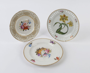 Three antique porcelain cabinet plates with hand-painted floral scenes, mid 19th century, one titled verso "Lesser Day Lily", ​the largest 24.5cm diameter