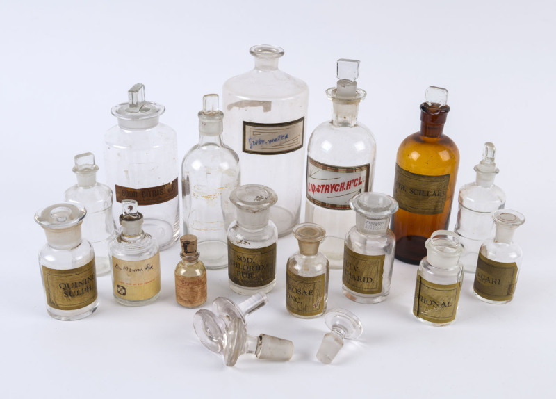 Fifteen assorted antique and vintage chemists bottles and two additional stoppers, 19th and 20th century, ​the largest 26cm high