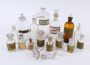 Fifteen assorted antique and vintage chemists bottles and two additional stoppers, 19th and 20th century, ​the largest 26cm high