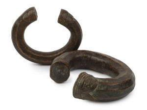 Two antique slave rings (manillas), solid copper and bronze, West African origin, 19th century or earlier, ​13cm and 11cm wide, 2kg total
