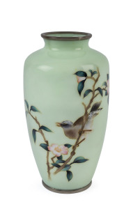 A Japanese cloisonne vase with bird and floral decoration on a soft green ground, early 20th century, 25cm high