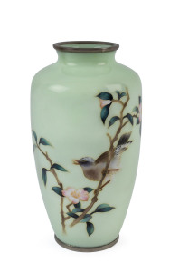 A Japanese cloisonne vase with bird and floral decoration on a soft green ground, early 20th century, ​25cm high