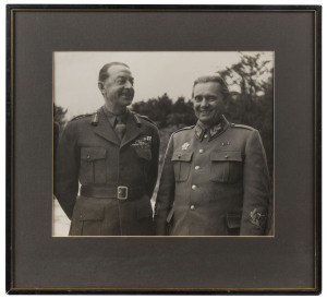 TITO Josip Broz (Yugoslav revolutionary and President of Yugoslavia from 1945-1980), black and white photograph of Tito with an English officer, signed below his tunic pocket (badly faded), 29 x 34cm, 45 x 48cm overall