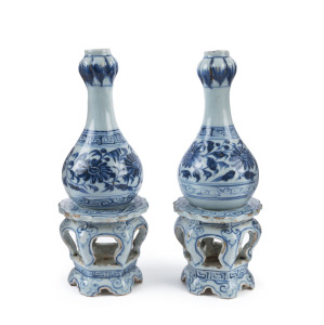 A pair of Chinese blue and white ceramic vessels on stands, 18th century, 23.5cm high