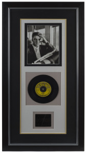 ELVIS PRESLEY: Attractive display featuring image of a seated Elvis aboard a train, demo 45rpm recording of "My Happiness" (Sun Records, 1953) and commemorative plaque for the "My Happiness" recording; stated to be a limited edition, numbered '438' of 500