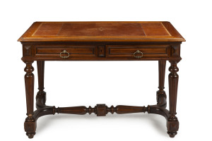 A French library table, turned and carved walnut with gilt tooled embossed leather top, 19th century, 75cm high, 114cm wide, 64cm deep