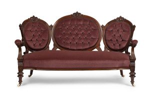 An antique English double ended settee, carved walnut frame with plum velvet upholstery, circa 1875, 180cm across the arms