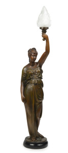 A figural feature lamp, patinated chalkware with glass flame shade, 20th century, 134cm high