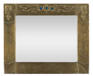 An English Arts and Crafts mirror, repoussé brass with enamel decoration, circa 1900, 47 x 57cm
