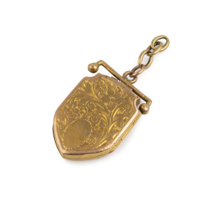 An antique 15ct gold shield shaped locket pendant, 19th century, 4cm high, 11.5 grams