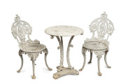 An antique cast iron table and two chairs, 19th century, ​the table 63cm high, 50cm diameter