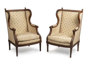 A pair of French bergères, carved walnut wingback frames with jacquard upholstery, 19th century, 66cm across the arms