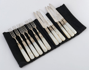 Set of six fruit knives and forks with silver collars, mother of pearl handles and engraved blades, 19th century, the knives 18cm long