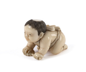 A Japanese netsuke of a small boy, carved ivory, Meiji period, 19th/20th century, 2.5cm high, 3.5cm wide