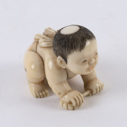 A Japanese netsuke of a small boy, carved ivory, Meiji period, 19th/20th century, ​2.5cm high, 3.5cm wide - 2