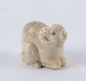 A Japanese netsuke of a ram, carved ivory, Meiji period, 19th/20th century, 3.5cm high, 4.5cm wide