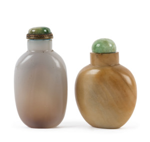 Two Chinese agate snuff bottles with jade tops, 19th century, 7cm and 6cm high