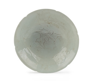 A Chinese fine porcelain bowl of lobed design with incised floral decoration, early Song Dynasty, 11th century, 5.5cm high, 19cm diameter. PROVENANCE: The Joshua McClelland Collection, Melbourne