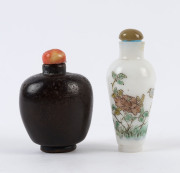 A Chinese boxwood snuff bottle with coral lid together with a glass and enamel example with agate lid, 19th/20th century, ​6cm and 7.5cm high