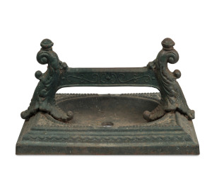 An antique cast iron boot scraper, 19th century, 37cm wide