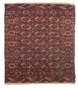 An antique Persian rug, hand-woven in reds, cream and black, late 19th early 20th century, 130 x 110cm. PROVENANCE: The Joshua McClelland Collection, Melbourne