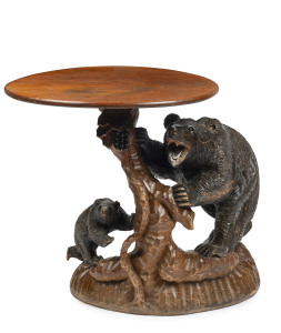A Black Forest carved bear table, early 20th century, 70cm high