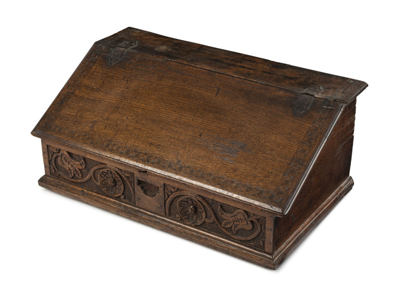 An English writing slope, carved oak with fitted interior,17th/18th century, ​33cm high, 75cm wide, 43cm deep