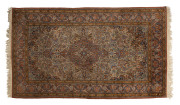 A Persian hand knotted silk rug, 20th century, 215 x 122cm