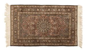 A Persian hand knotted silk rug, 20th century, 154 x 95cm