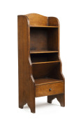 An English oak dwarf bookshelf, early 20th century, 87cm high, 38cm wide, 25cm deep