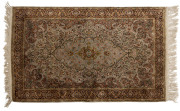 A Persian hand knotted silk rug, 20th century, 150 x 92cm