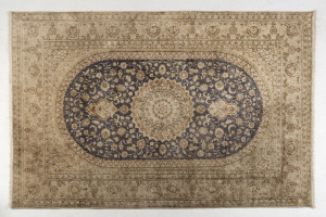 A Persian silk hand knotted rug in blue and cream, 20th century, 190 x 123cm