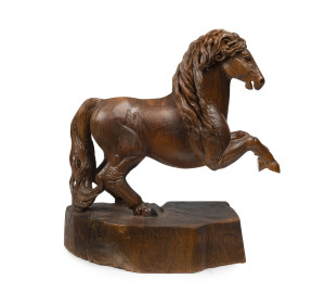 A Spanish carved timber horse statue, circa 1900, 85cm high, 80cm long