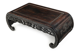 A Chinese opium table, carved timber, 19th/20th century, 32cm high, 89cm wide, 43cm deep