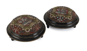A pair of antique English footstools, ebonized timber with gilt metal trim and bead work tapestry tops, circa 1870, 14cm high, 31cm diameter
