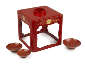 Japanese Sakazuki (sake stand), red lacquer with gold decoration; plus three sake cups, Meiji period, (4 items), 24cm high