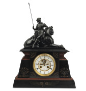 A French Egyptian Revival mantel clock, time and strike movement with open escapement, fine slate and rouge marble case with bronze statue top, 19th century, 55cm high