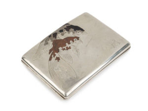 An antique Japanese silver cigarette case engraved with koi carp decorated in copper and niello, circa 1900, stamped "Silver 950", 12cm wide, 127 grams