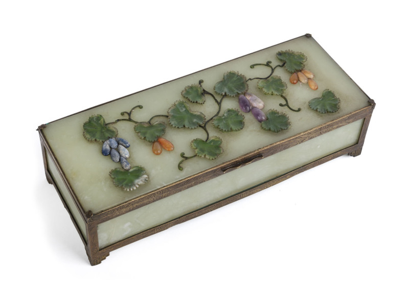 A Chinese jewellery box, celadon jade, gilt metal and semi-precious stones, early 20th century, 5.5cm high, 21.5cm wide, 9cm deep