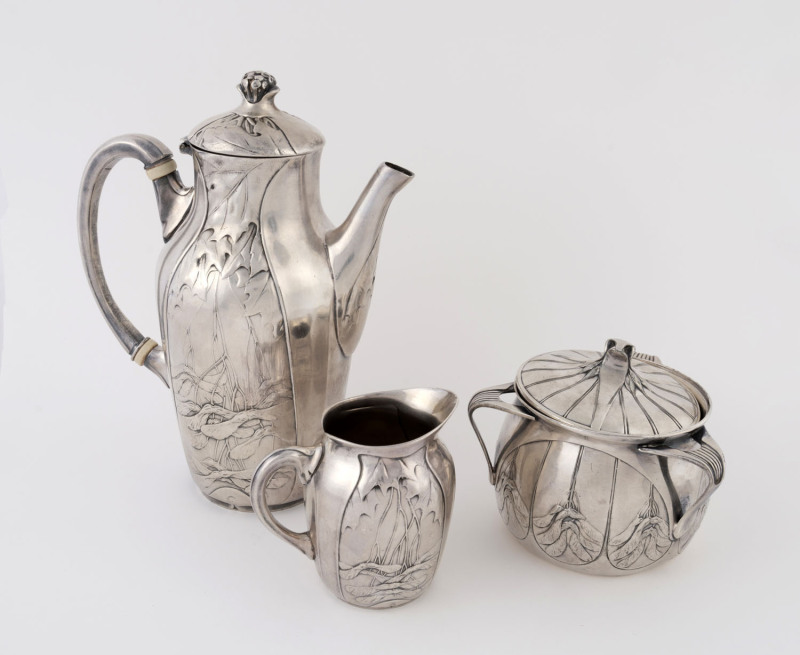 CHRISTOFLE French Art Nouveau silver plated three piece tea service, circa 1900, stamped "Gallia Metal" with pictorial marks, ​the tea pot 21cm high