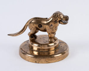 A novelty dog nutcracker, cast brass with remains of gold plated finish, early 20th century, ​14cm high