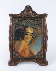 A fine repoussé copper picture frame with Art Deco portrait, early 20th century, 37 x 24cm